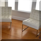 F13. Pair of white leatherette cantilever chairs.  